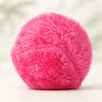 RoamRoll rolling ball wearing its pink plush cover.