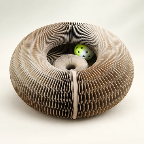CurlNest paper scratcher showing its circular profile and proportions.